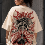 Woman wearing Luri Bankai anime graphic oversized t-shirt — cream unisex streetwear tee with dark grunge anime warrior print in red and black, Japanese kanji and flame motifs, back view