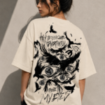 Woman wearing Luri Before My Eyes anime graphic oversized t-shirt — cream unisex tee back view with dark anime spinning eye and crow illustration, "Any Technique Is Worthless Before My Eyes" grunge text