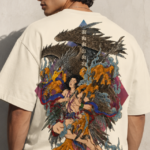Man wearing Luri Garuda Mythology graphic oversized t-shirt — cream unisex tee with detailed ukiyo-e style Garuda divine eagle descending with multi-armed deity, Sanskrit script and gold detail, back view