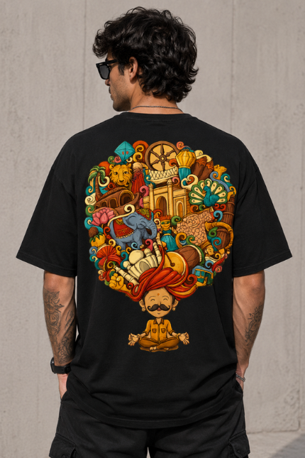 Man wearing Luri India Mind graphic oversized t-shirt — black unisex tee with vibrant Indian culture doodle art featuring meditating rajasthani figure, elephant, lotus, peacock and temple, back view