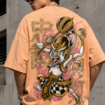 Man wearing Luri Monkey King graphic oversized t-shirt in peach — unisex anime mythology tee with Sun Wukong golden staff illustration, checkered armour and kanji script on premium Supima Cotton, back view