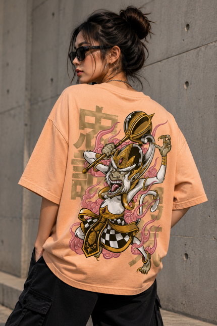 Woman wearing Luri Monkey King graphic oversized t-shirt in peach — unisex tee with anime-ukiyo-e Sun Wukong illustration wielding golden staff, pink clouds and Japanese kanji, back view