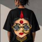 Woman wearing Luri No Means No graphic oversized t-shirt — black tee with bold pop-art Indian woman print featuring bindi, maang tikka, yellow choker and "No Means No" sunglasses, back view close