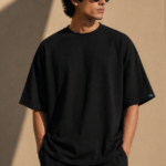 Man wearing Luri Signature Oversized Tee in black — premium unisex 260 GSM Supima Cotton t-shirt, front view, clean minimal boxy oversized fit