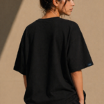 Man wearing Luri Signature Oversized Tee in black — premium unisex 260 GSM Mercerized Supima Cotton t-shirt, front view, clean minimal boxy oversized fit
