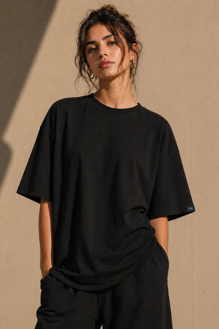 Man wearing Luri Signature Oversized Tee in black — premium unisex 260 GSM Mercerized Supima Cotton t-shirt, front view, clean minimal boxy oversized fit