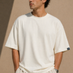 Man wearing Luri Signature Oversized Tee in off-white — 100% Mercerized Supima Cotton 260 GSM premium t-shirt, front view, clean boxy oversized fit with matching co-ord