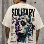Man wearing Luri Solitary Star graphic oversized t-shirt — cream unisex streetwear tee with bold grunge classical art print, star motifs and "Built Different Made For More" typography, back view